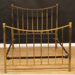 An Arts & Crafts brass bed, 139cm high, the internal 194cm x 140cm