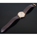 An Omega gold plated gentleman's wristwatch, 3cm champagne dial with baton markers, date aperture,