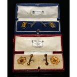 A pair of yellow metal cufflinks, cast with oriental character and bar terminals, one indistinctly