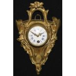 A 19th century French ormolu cartel timepiece, 7cm convex enamel clock dial inscribed with Roman and