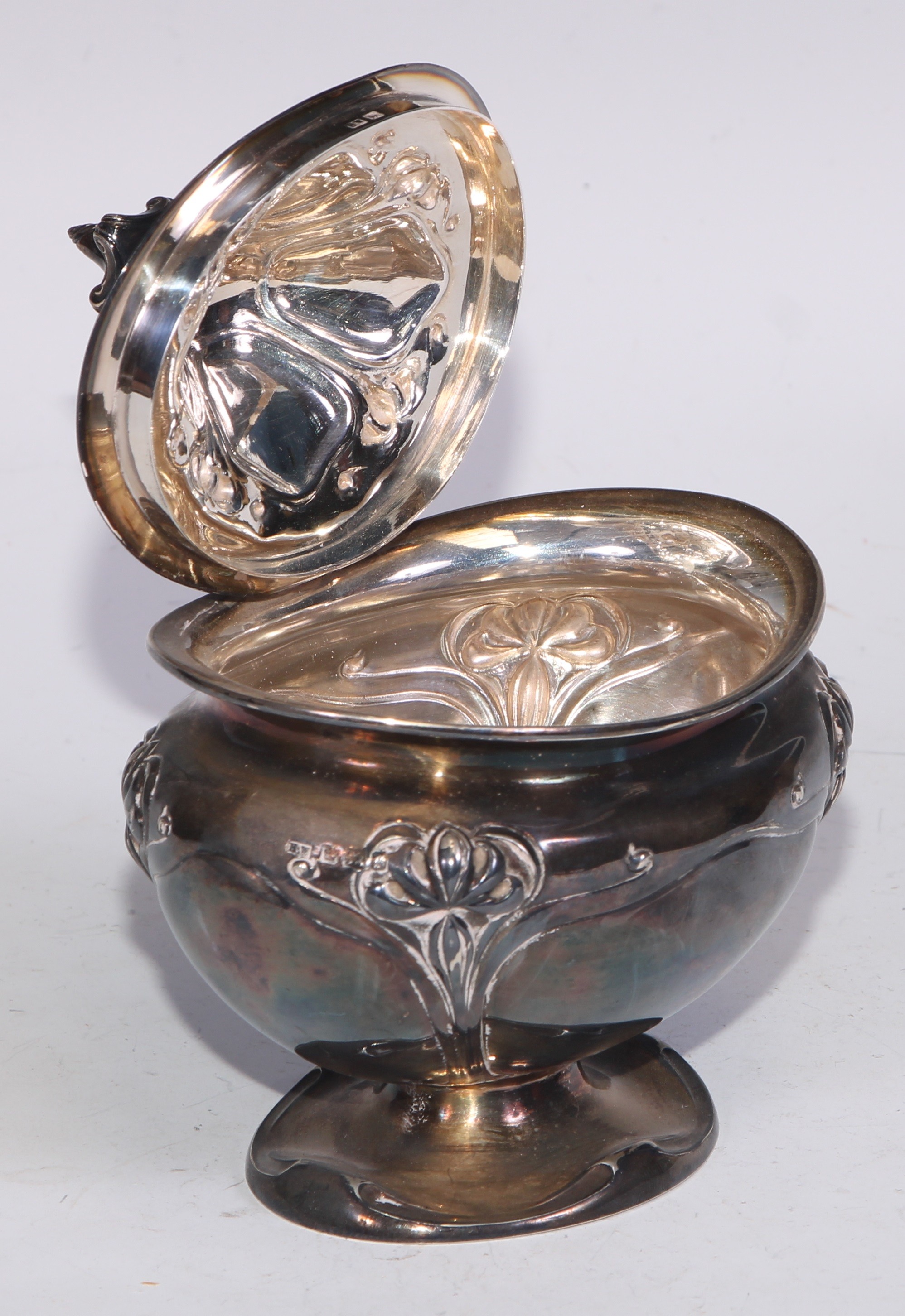 An Art Nouveau silver bombe shaped tea caddy, embossed with stylised flowers on whiplash stems, - Image 3 of 5