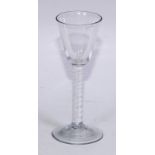 A George III opaque twist wine glass, conical bowl, double-helix stem, domed foot, 15cm high, c.1765