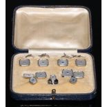 A gentleman's 9ct white gold dress set, comprising four buttons, a pair of cufflinks and two