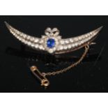 A late Victorian sapphire and diamond crescent and ribbon bow brooch, central oval blue sapphire