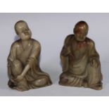A Chinese soapstone figure, of a monk, seated, parting his robe, Buddha displayed on his chest, 12.