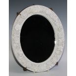 A late 19th century oval mirror, possibly King Street, Derby, in the white, encrusted with
