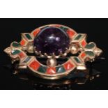 A Victorian Scottish hardstone and amethyst gold coloured metal brooch, the large central claw set