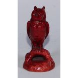 A Bernard Moore flambe model, of an owl perched on a root, 9cm high, impressed mark