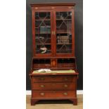 A Sheraton Revival mahogany and marquetry bureau bookcase, the associated top with moulded cornice