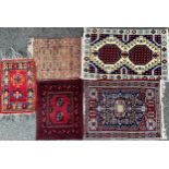 A Persian woollen prayer mat, with two guls, surrouned by geometrical motifs, 92cm x 59cm; others,