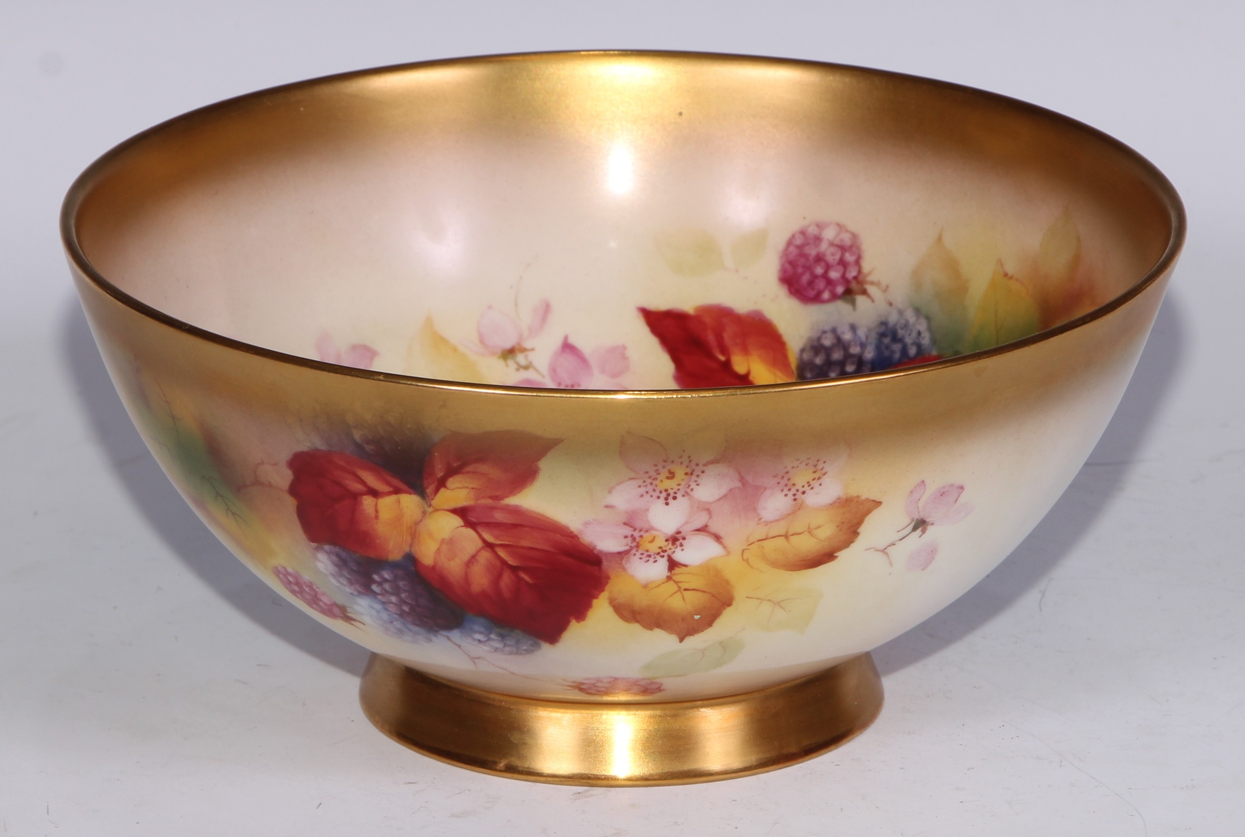 A Royal Worcester bowl, painted by Kitty Blake, signed, with blackberries, leaves and blossom,