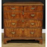 A George II walnut chest, rectangular top above two short and three long graduated drawers,