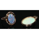 A 9ct gold black opal oval cabochon ring, collar set within open shank, stamped 375, size P, 3.6g