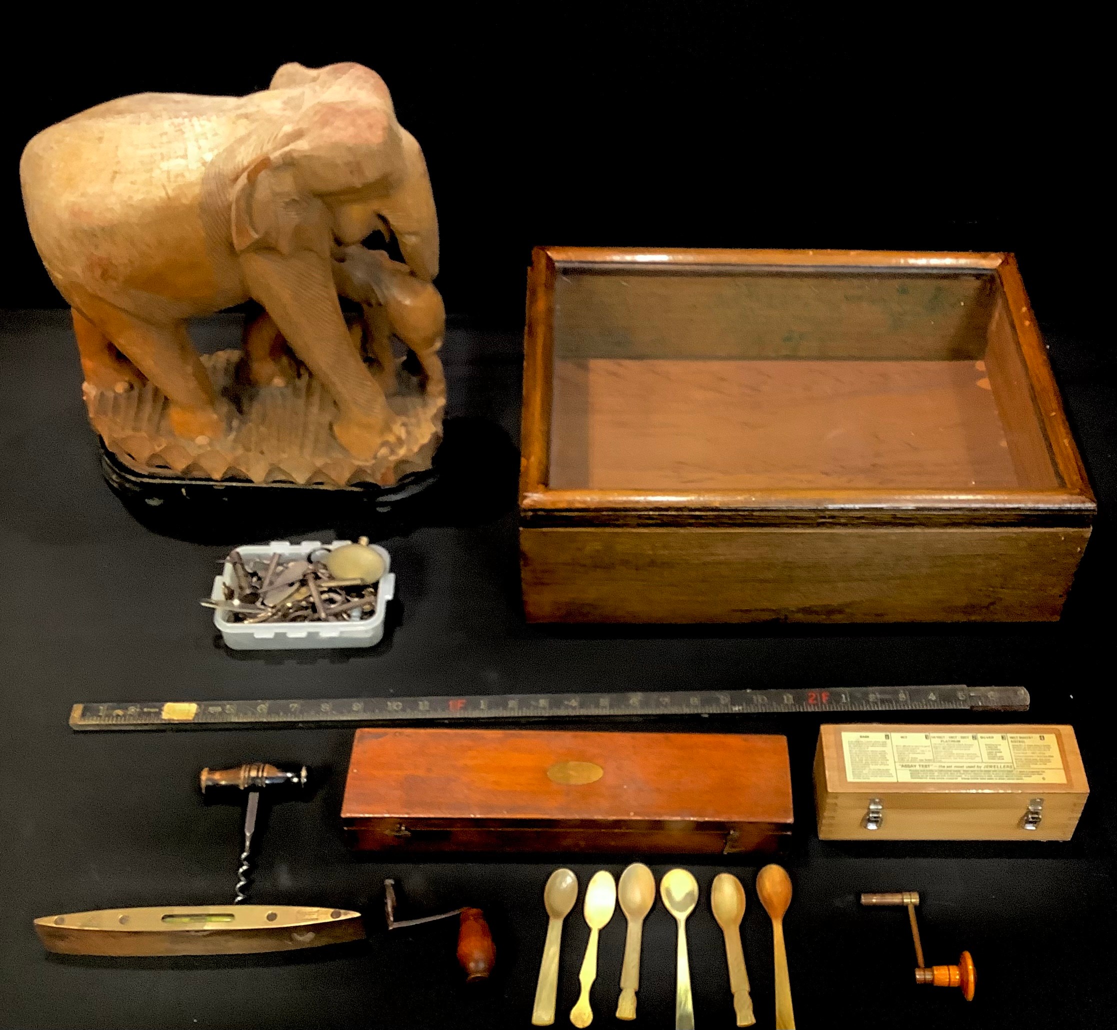 An oak bijouterie cabinet, 48cm x 36cm; a Stanley ruler case; a level; watch keys and winders; etc