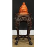 A Chinese hardwood jardiniere stand, octagonal top with inset soapstone panel above a shaped and
