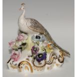 A Royal Crown Derby model, of a peacock, 18cm high, green printed mark