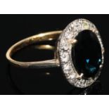 A sapphire and diamond ring, large central deep blue sapphire measuring 12.50mm x 10.30mm x 4.