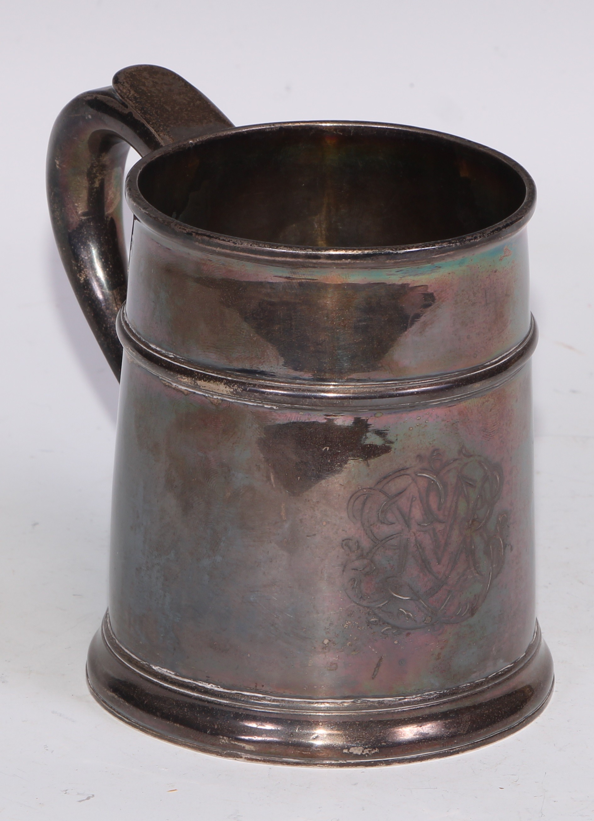 A Queen Anne Britannia silver mug, quarter girdle, S-scroll handle, skirted base, 12cm high, Anthony