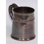 A Queen Anne Britannia silver mug, quarter girdle, S-scroll handle, skirted base, 12cm high, Anthony