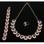 A suite of amethyst, seed pearl and 9ct gold jewellery, comprising necklace, bracelet and ring, each