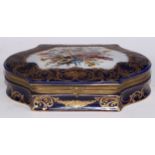 A Continental gilt metal mountede porcelain casket, decorated in polychrome with a musical trophy,
