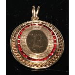 A 14ct gold oval pendant, pierced with a band of wirework, engraved to the centre, 5cm high over