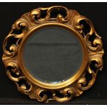 An 18th century style circular looking glass, pierced and carved giltwood acanthus carved frame,