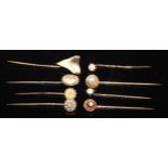 A 19th century diamond and seed pearl yellow metal stick pin, others blister pearl, sharks tooth,