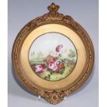 A 19th century English porcelain plaque, possibly Derby, painted with an upturned basket of summer