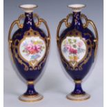 ***LOT WITHDRAWN***A pair of Royal Crown Derby two handled pedestal vases, painted by Charles