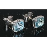 A pair of aquamarine baguette cut earrings, each 8.10mm x 6.30mm x 3.20mm, total estimated