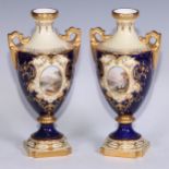 ***LOT WITHDRAWN***A pair of Coalport ovoid pedestal vases, painted with landscapes within oval