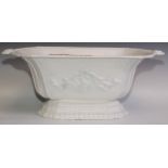 A Victorian cast iron garrden trough, cast with scrolls, white painted, 67cm wide, 26cm high