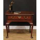 A George III mahogany crossbanded oak side table, slightly oversailing top above a long drawer,