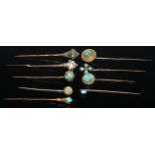 A 19th century turquoise yellow metal stick pin, bulbous top; others, claws, cross, shield boss etc,