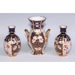 A Royal Crown Derby 6299 pattern Imari fluted ovoid vase, 15cm high, printed mark; vases, similar (