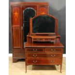 An Edwardian mahogany two-piece bedroom suite, comprising wardrobe, 200cm high, 121cm wide, 46cm