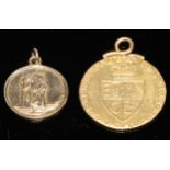 A George III gold spade guinea, 1787, mounted, 8.6g gross; a 9ct gold St Christopher pendant, 2.