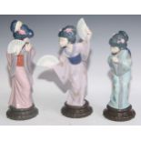 A Lladro figures, of Geisha girls, standing with fans, 29cm high, printed mark; others (3)