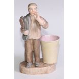 A Sampson Hancock Derby novelty figural spill holder, as a gentleman retiring to bed, 14cm high,