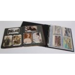 Postcards - an Edwardian postcard album containing various black and white postcards relating to the