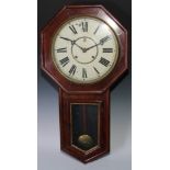 A late 19th century American drop-dial wall clock, eight day movement striking on a gong,