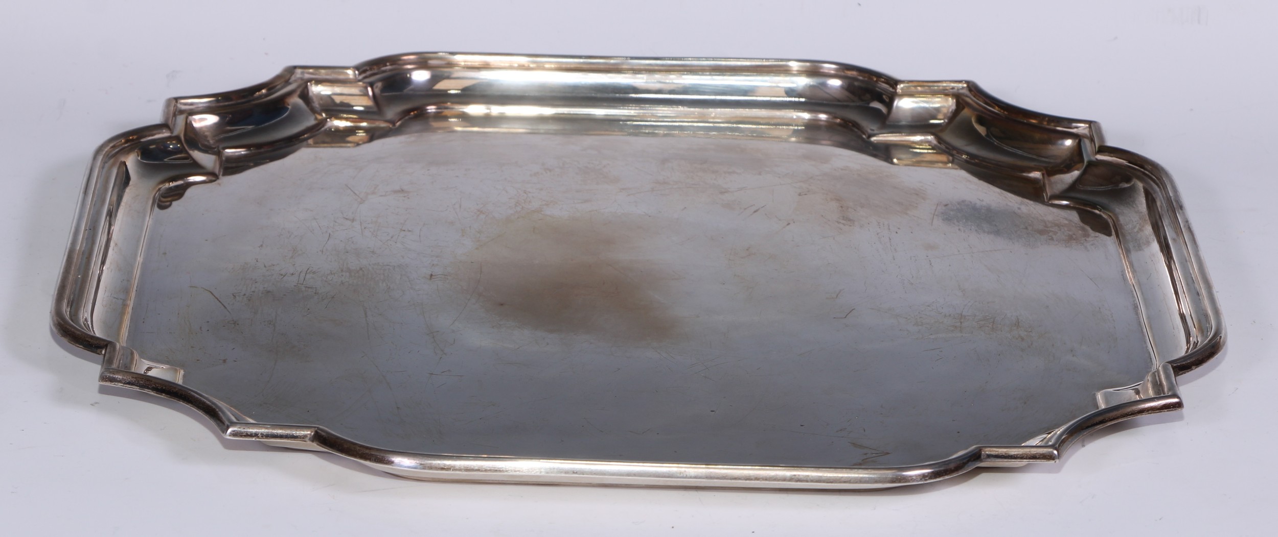 A Elizabeth II silver shaped square salver, of George I design, plain field, 36.5cm wide, Barker