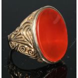 A large carnelian signet ring, plain oval matrix, 9ct gold shank, size U, London 375 marks, 14.6g