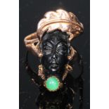 A Corletto 14ct gold Blackamoor Ring, the carved head with articulated earrings and open wirework