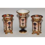 A pair of Royal Crown Derby 1128 pattern flared cylindrical vases, lion paw feet, 10.5cm high,
