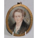 English School, early 19th century, an oval portrait miniature on ivory, young gentleman in black