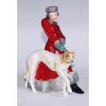 A Royal Crown Derby figure, Olga, she stands, wearing a fur trimmed red trench coat holding a