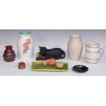Ceramics - a Bretby model of a cat, modelled with a ball, impressed mark; a 19th century beer jug,