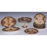 A Royal Crown Derby dessert service, comprising a comport, two sihes and nine plates, decorated in